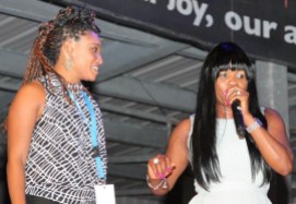 Dancehall icon Lady Saw shares a fun on-stage moment with a local attendee